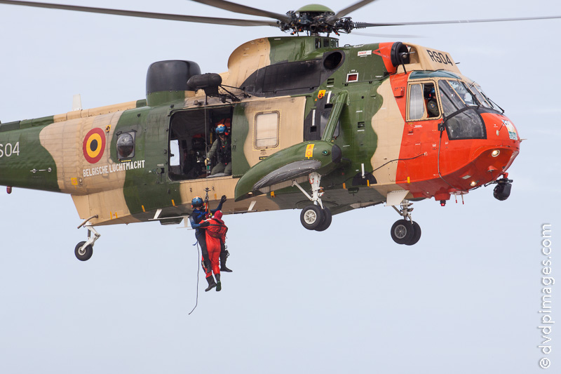 The rescued person is carried onto the beach.